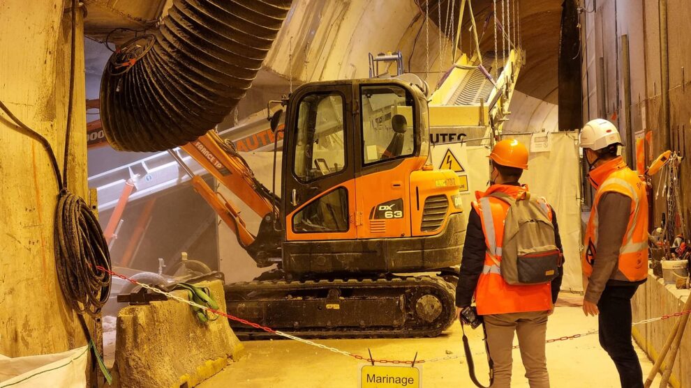 Removal of excavated material with a site conveyor